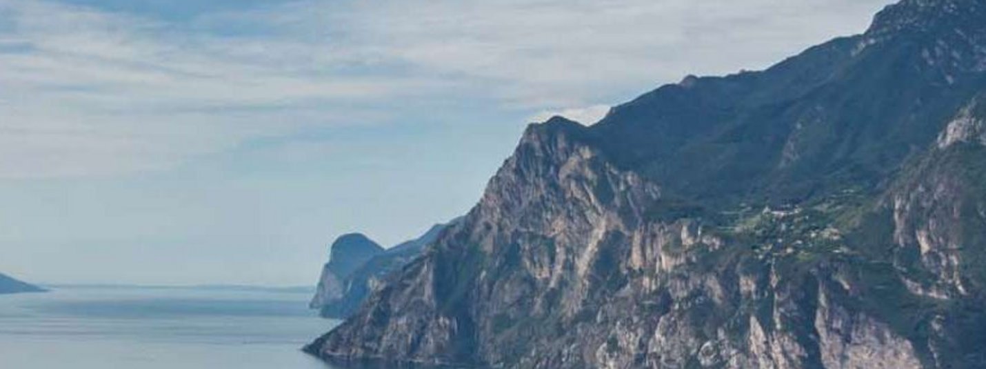 Cycle tour Trento - Garda © Tourismusverein Tramin View of a fjord with steep mountains and a cloudy sky