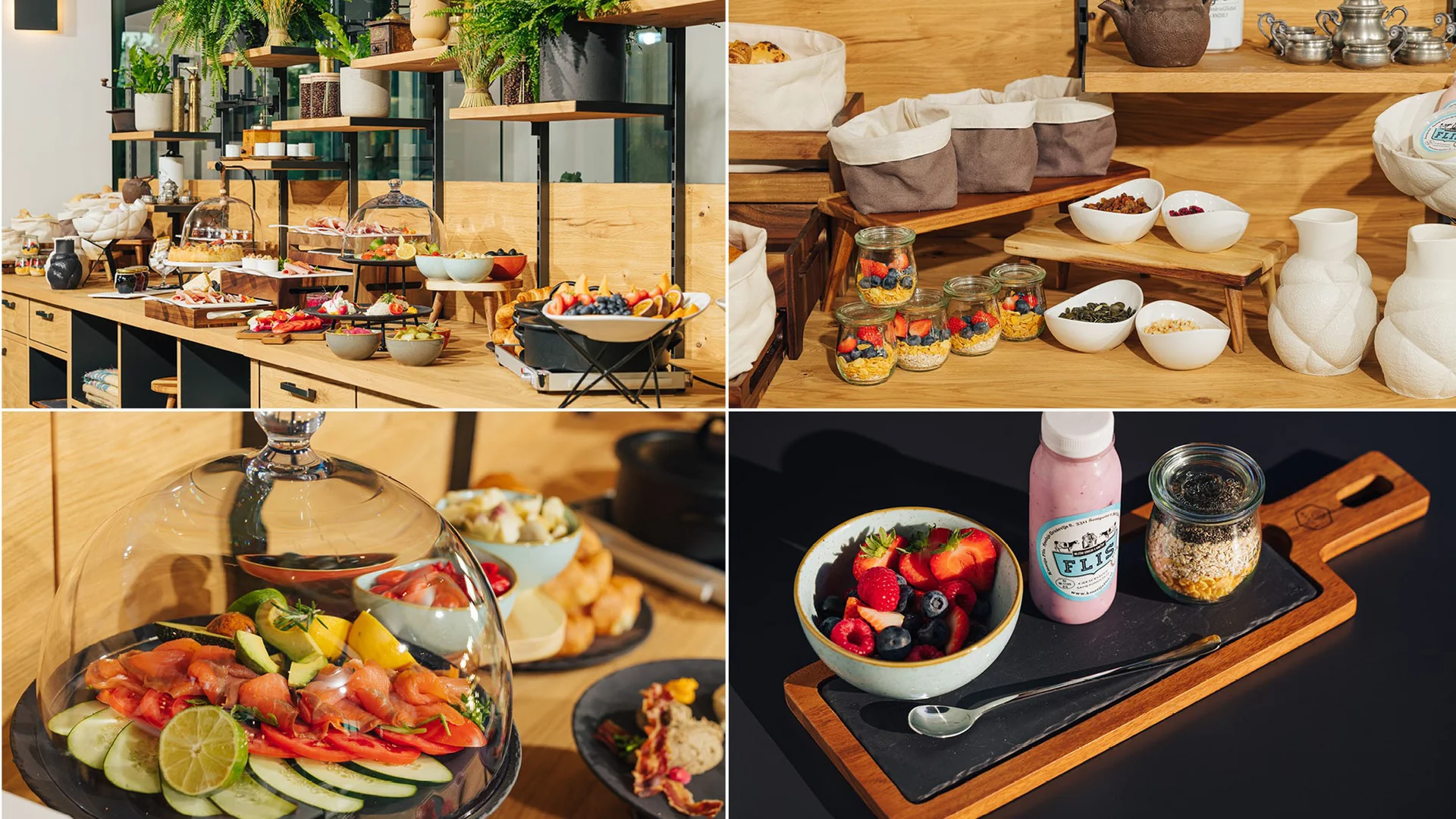 Buffet mit frischem Obst, Gebäck, eingelegtem Gemüse und Frühstückszutaten auf Holztheke