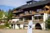 Exterior view of Landhotel Fuchs with balcony and white advertising flag