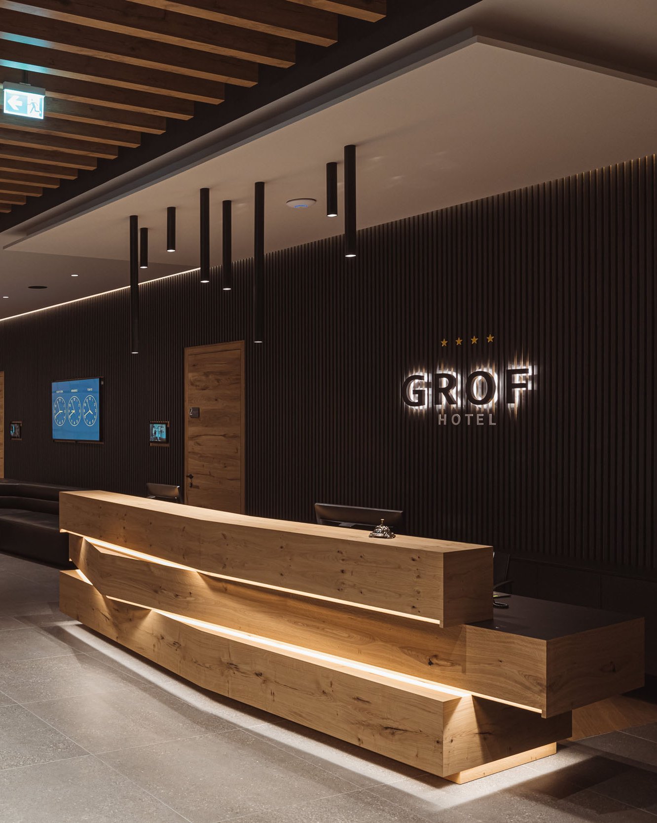 Slovenia Gravel Experience © Ziga Intihar Modern hotel lobby with wooden elements and reception desk