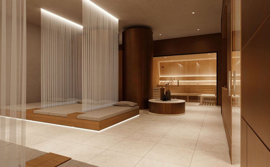 Modern wellness area with wooden loungers and sauna in the background