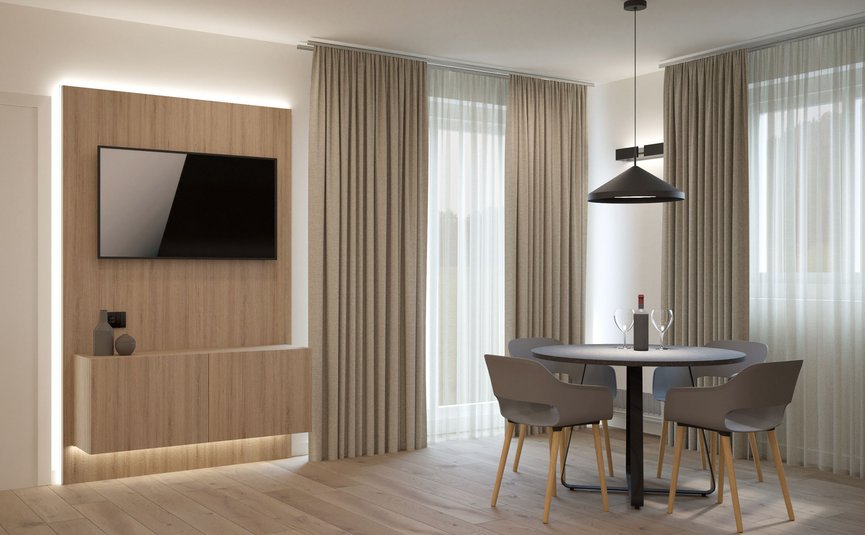 Garni Hotel Cornelian **** © Garni Hotel Cornelian Moderner Essbereich mit rundem Tisch, vier Stühlen und Wandfernseher