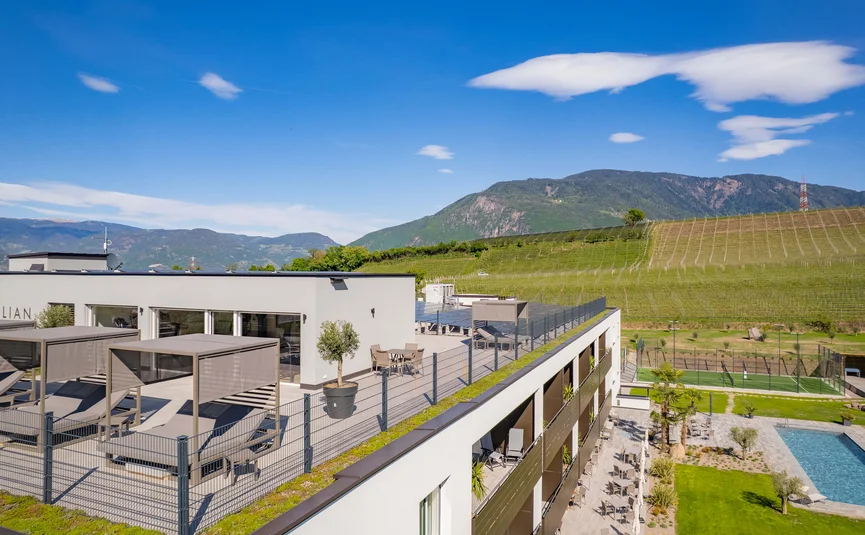 Rooftop terrace of modern building with mountain view and swimming pool