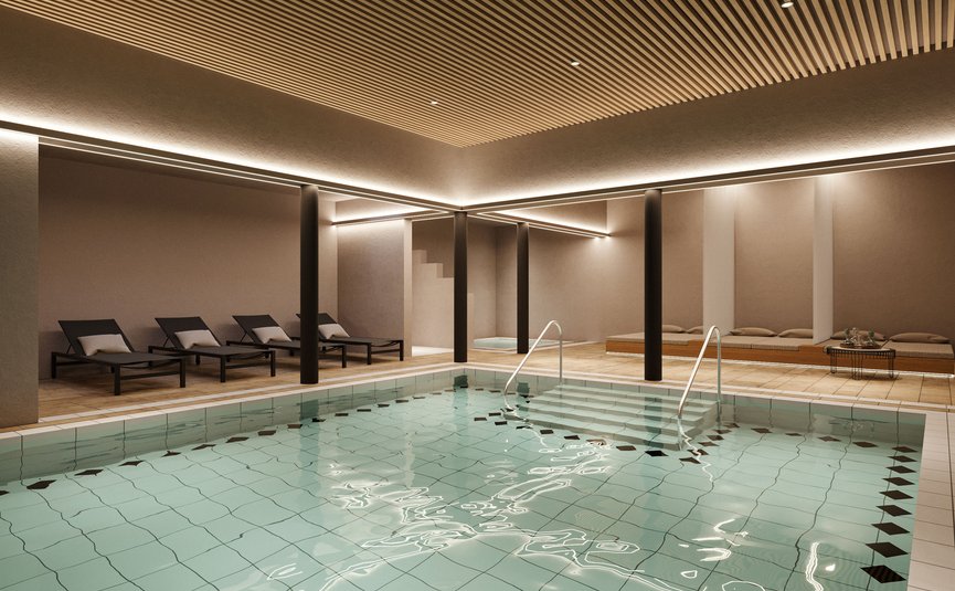 Indoor modern spa pool with lounge chairs and warm lighting