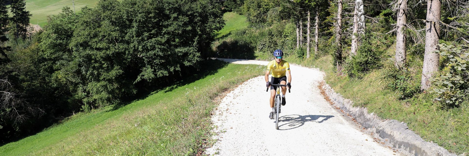 Hotel Grof **** © Kaja Ribezl Cyclist riding on a forest path in hilly countryside on a sunny day