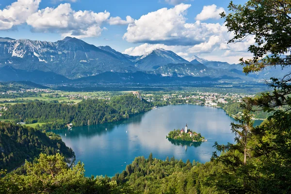 Slovenia © Jost Gantar - www.slovenia.info Lake with island and mountain landscape under clear sky