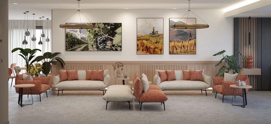 Modern gestalteter Lounge-Bereich mit Sofas, Sesseln und Wandbildern