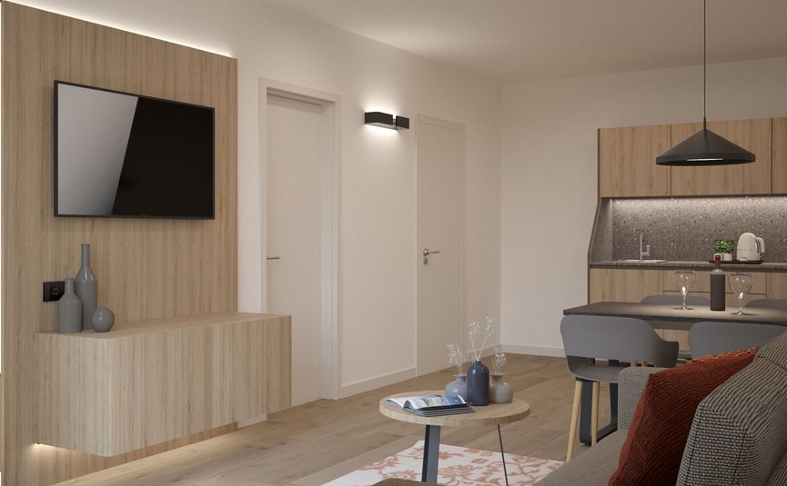 Garni Hotel Cornelian **** © Garni Hotel Cornelian Moderner Wohnbereich mit Holzpaneelen, Sofa, Tisch und offener Küche