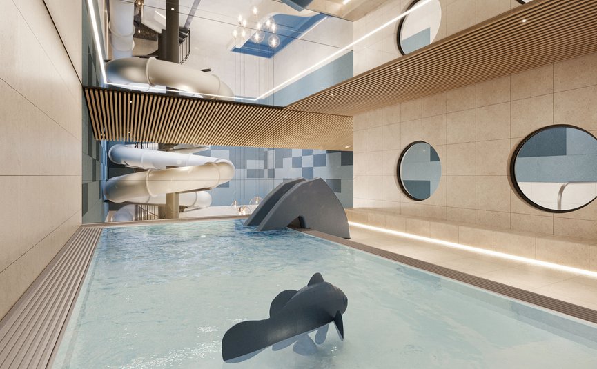 Indoor pool with children's slide and circular wall mirrors