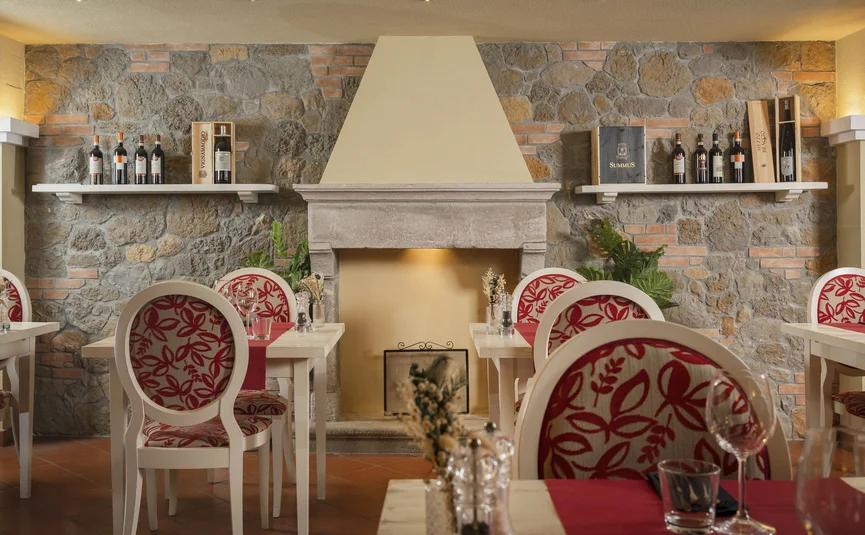 Cozy restaurant interior with stone wall and fireplace