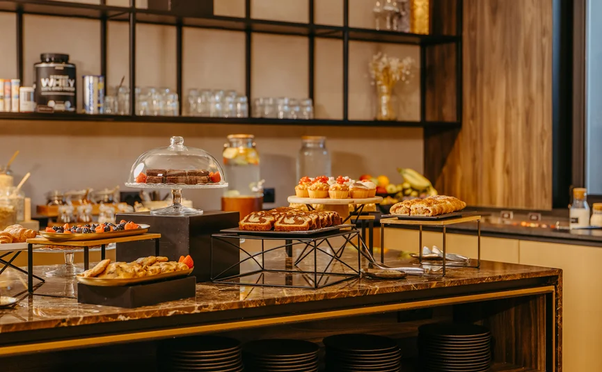 Buffet with assorted pastries and desserts on a table in a café