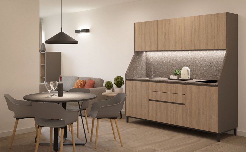 Garni Hotel Cornelian **** © Garni Hotel Cornelian Moderner Essbereich mit runder Tafel und kompakter Küchenzeile in Holzoptik